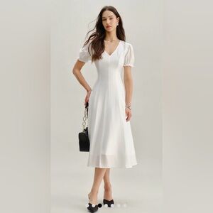 RIHOAS Nordsrom white puff sleeve midi dress with a Vee Neck design size small